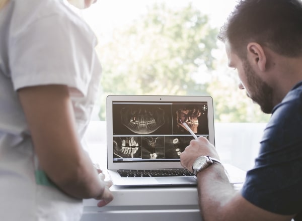 Dentist reviewing the CEREC dental restoration process