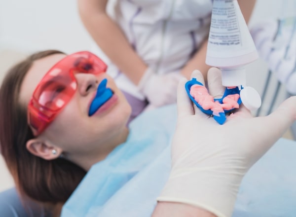 Dental patient receiving fluoride treatment