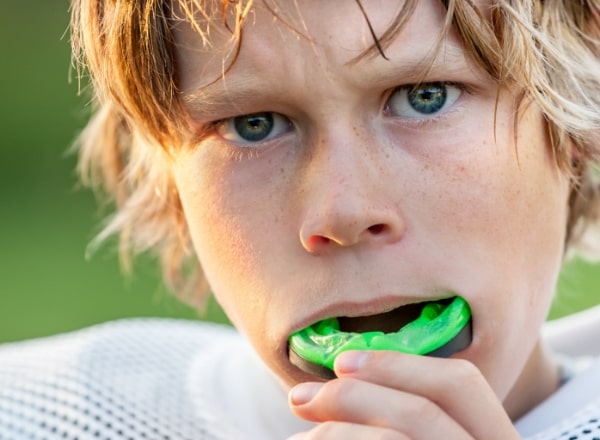 Teen placing a sportsguard