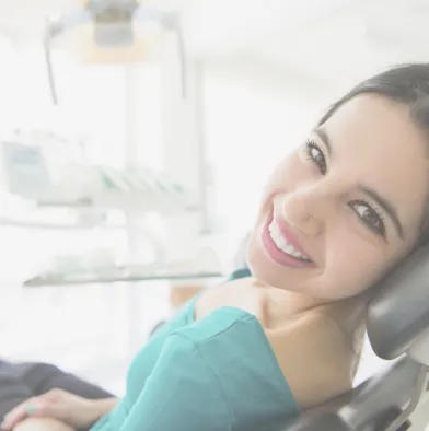Young woman smiling in dental chair