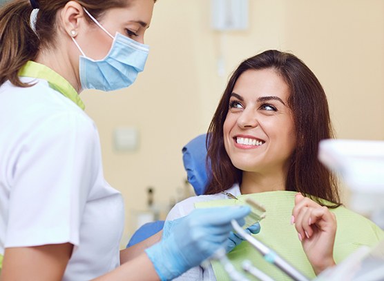 a patient smiling during the dental crowns process