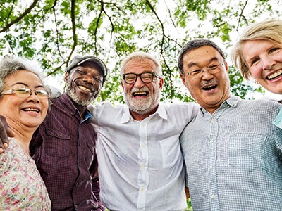 Patients in Phoenix smiling together with dentures