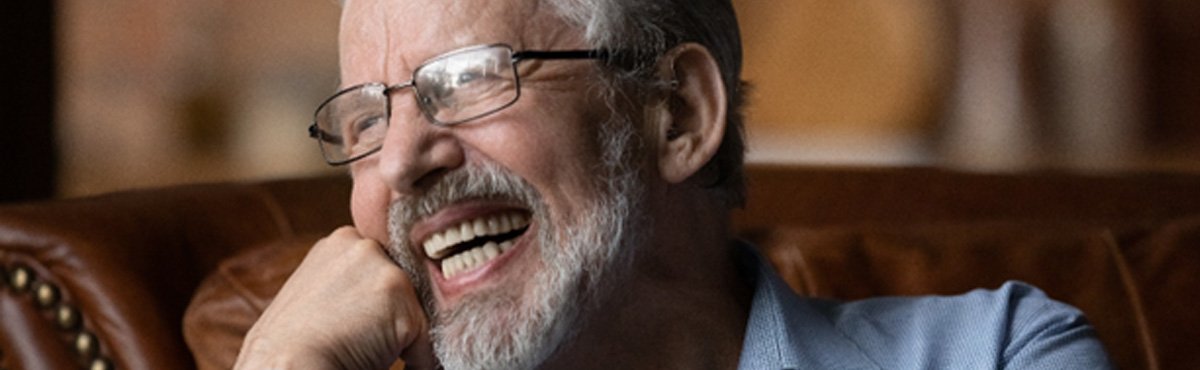 Man laughing in chair