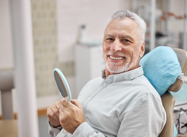 man smiling after getting dental implants in Phoenix 