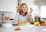 a woman enjoying healthy fruits