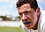 a man wearing a mouthguard to protect teeth