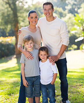 family of four taking family photo