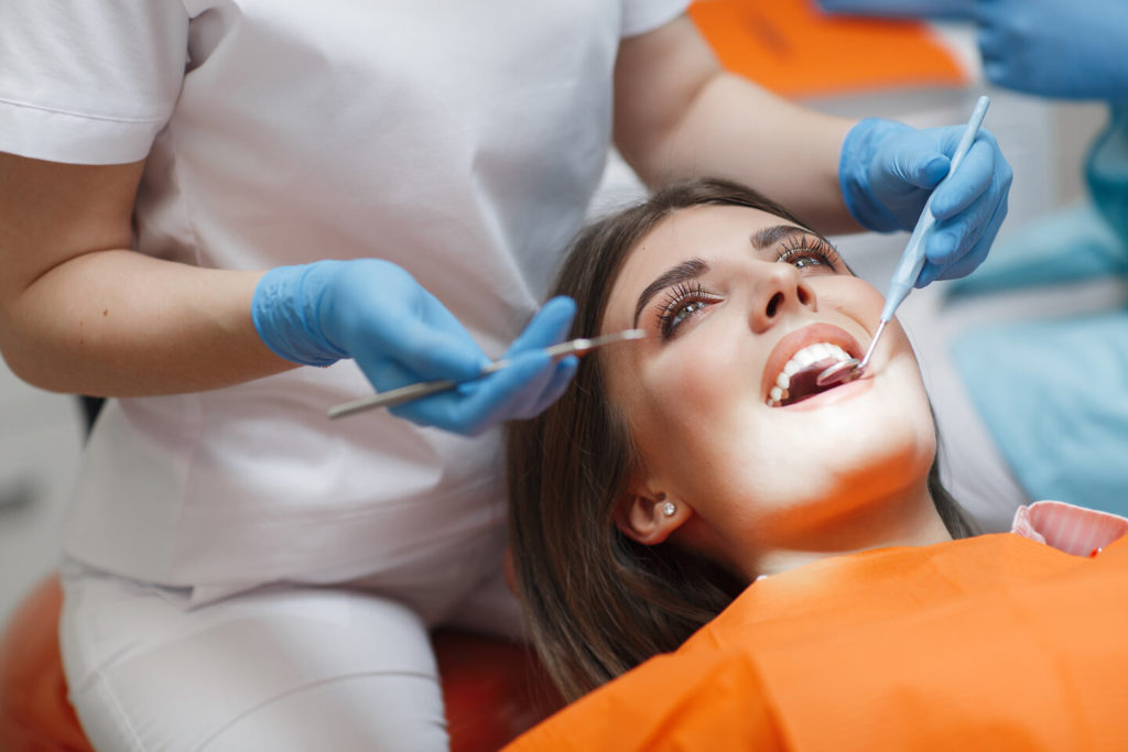 patient getting dental checkup and cleaning in Phoenix