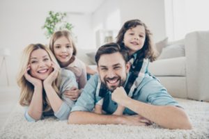 A family smiling cheerfully.