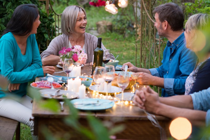 Friends eating in garden