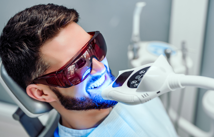 Man receiving dental whitening treatment